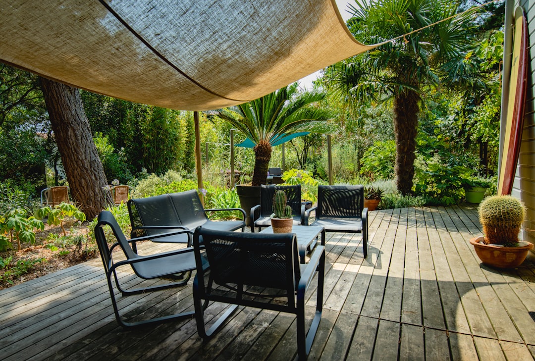 about-02 outdoor-seating-area-with-chairs-and-table-under-canopy-aux2gzyhvwy